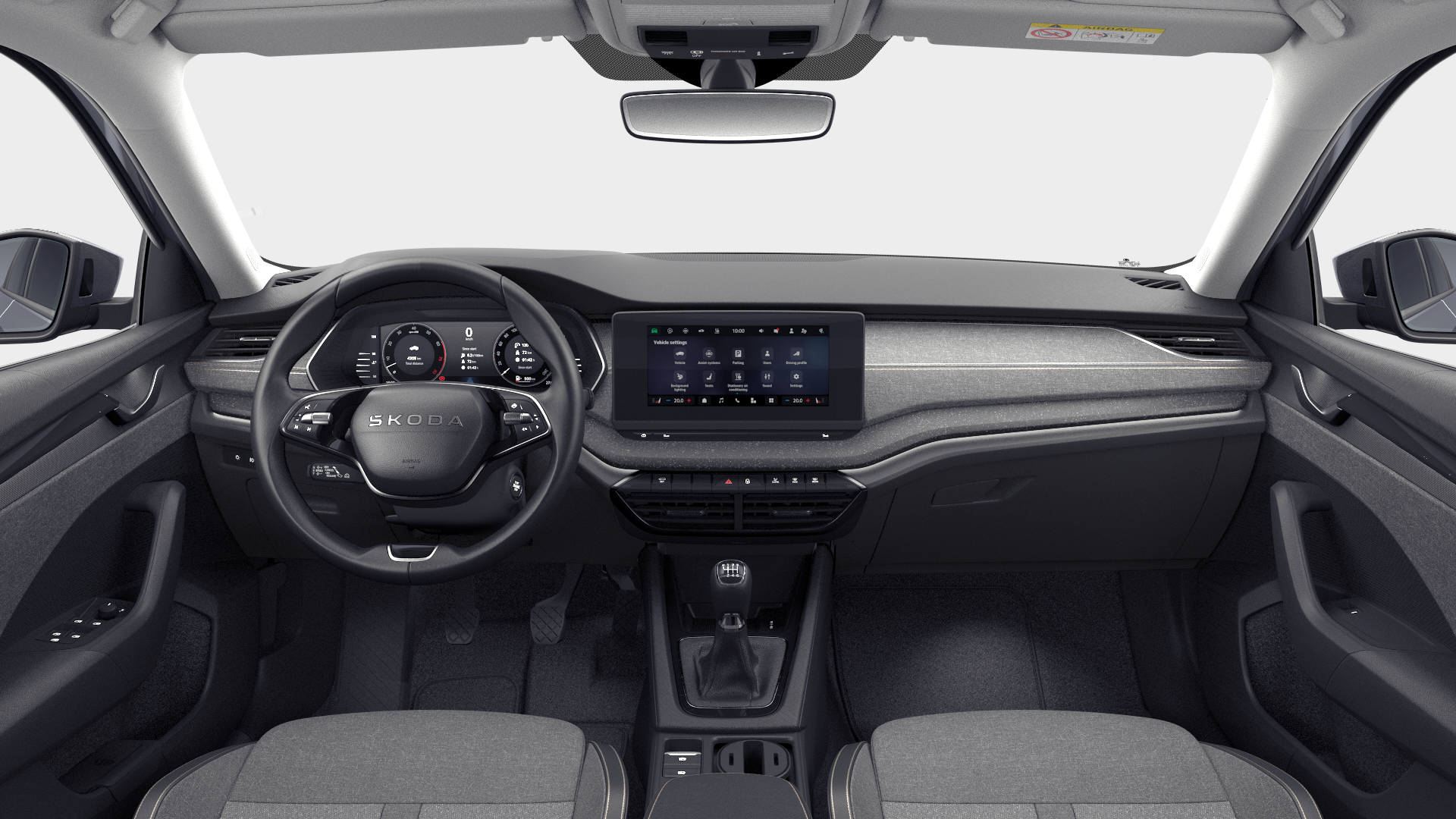Notranjost avtomobila Škoda Octavia Combi z osrednjim zaslonom na armaturni plošči, volanom in sedežema.